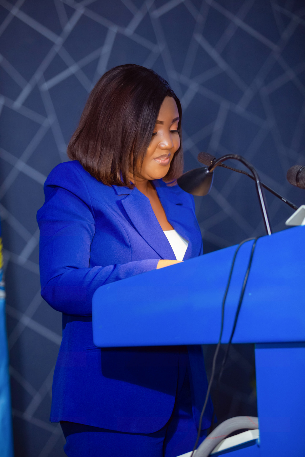 A speaker reading her remarks at the KAIPTC lectern