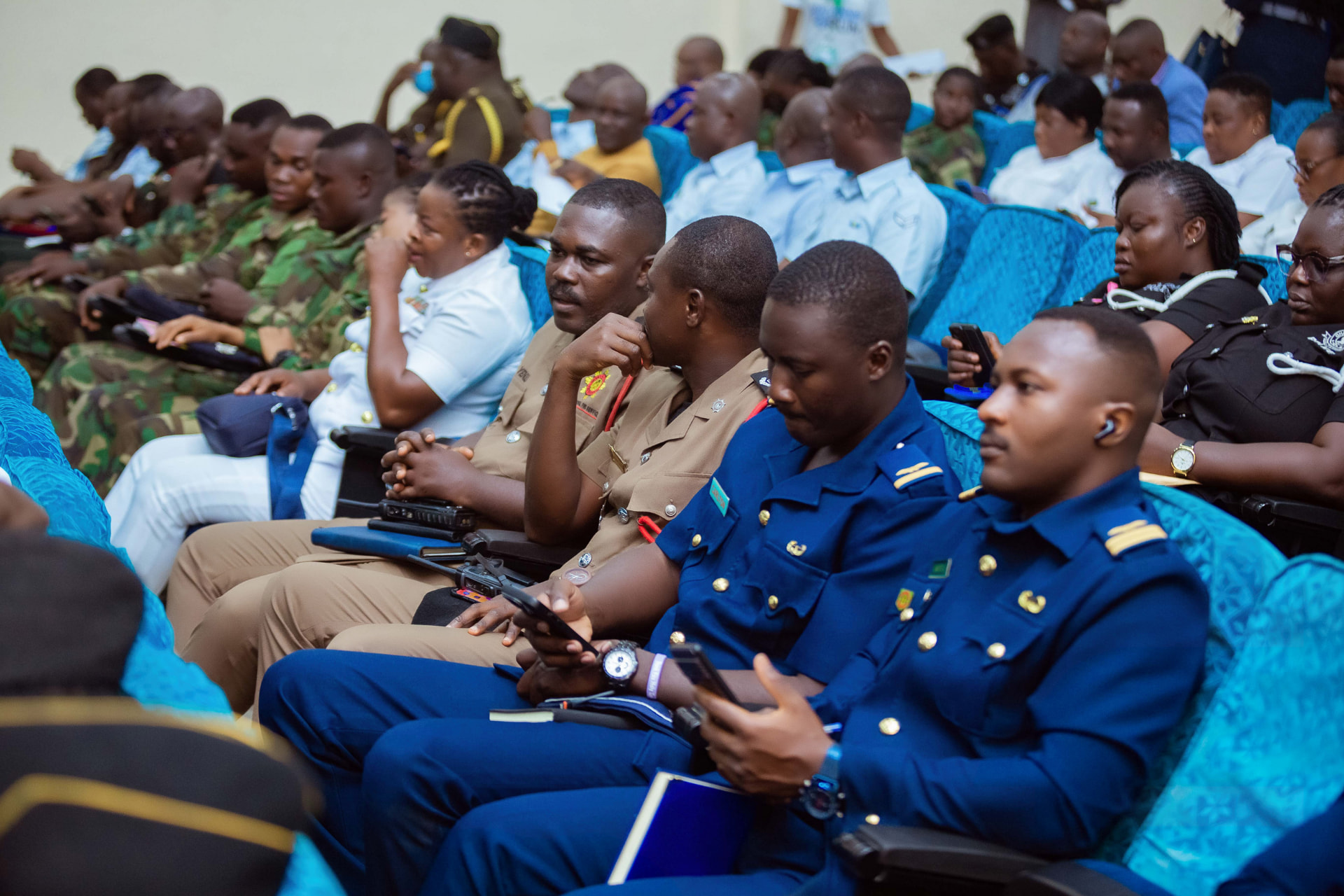 Military and security officers listening in the auditorium